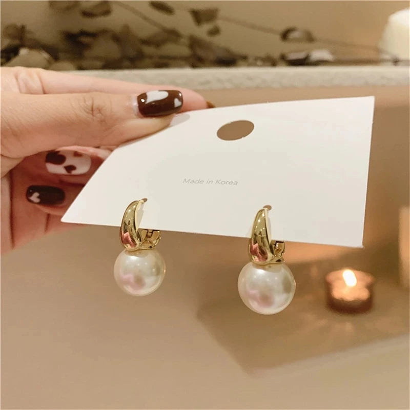 Pearl Earrings.